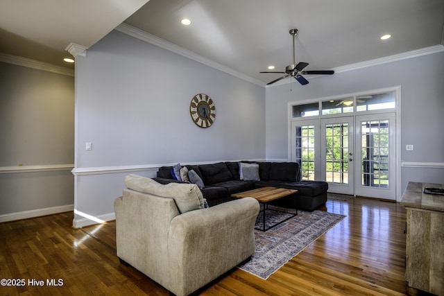 living room with crown molding, ceiling fan, dark hardwood / wood-style flooring, and french doors