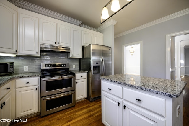 kitchen featuring light stone counters, ornamental molding, white cabinets, and appliances with stainless steel finishes