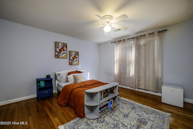 bedroom featuring wood-type flooring and ceiling fan