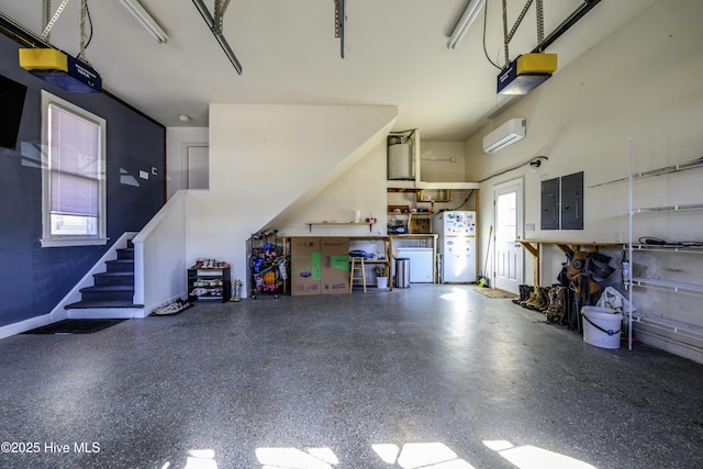 garage featuring a wall mounted air conditioner, a garage door opener, electric panel, and white fridge