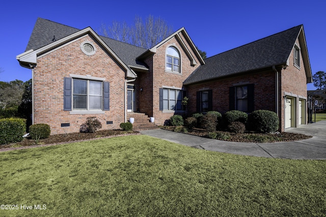 front facade with a garage and a front yard