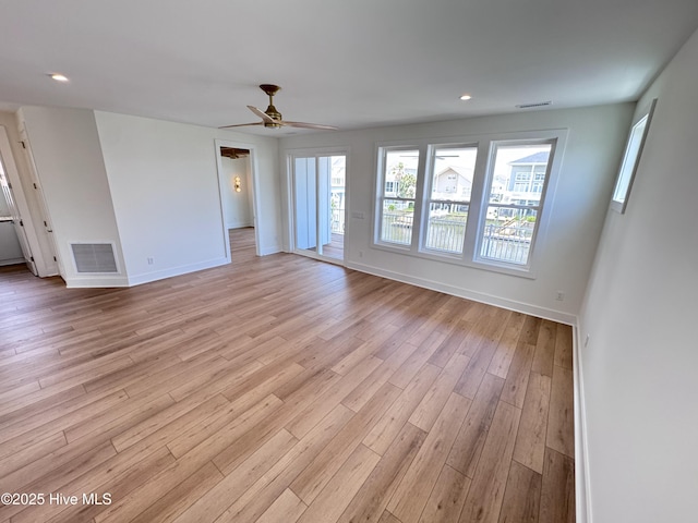 36 Fairmont St, Ocean Isle Beach, NC 28469 - unfurnished living room with baseboards, light wood-type flooring, ceiling fan, and recessed lighting