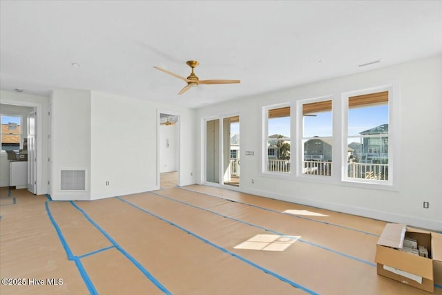 interior space featuring visible vents and ceiling fan