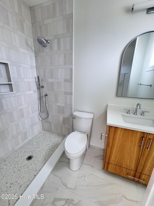 36 Fairmont St, Ocean Isle Beach, NC 28469 - full bath with marble finish flooring, toilet, tiled shower, baseboards, and vanity