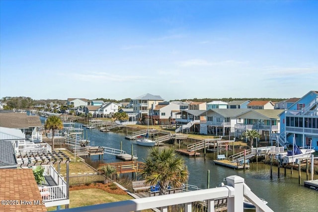property view of water featuring a floating dock and a residential view