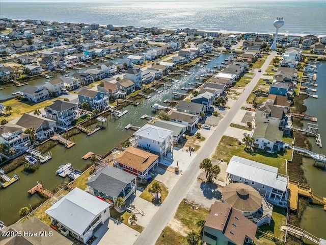 birds eye view of property featuring a residential view and a water view