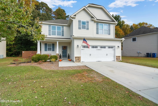 view of front facade with a garage and a front lawn