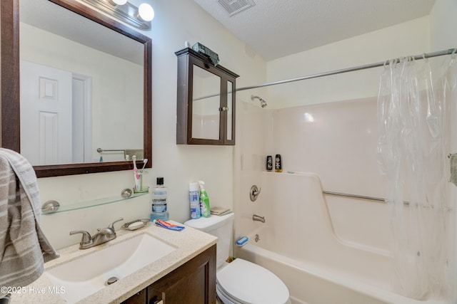 full bathroom with shower / bath combination with curtain, vanity, toilet, and a textured ceiling