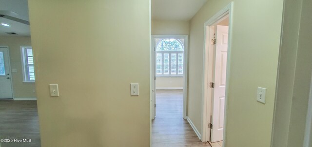 empty room featuring lofted ceiling and light hardwood / wood-style flooring