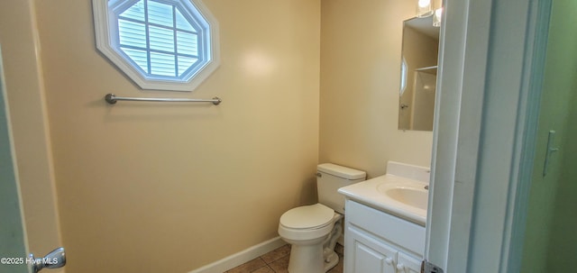 bathroom with vanity, tile patterned floors, and toilet