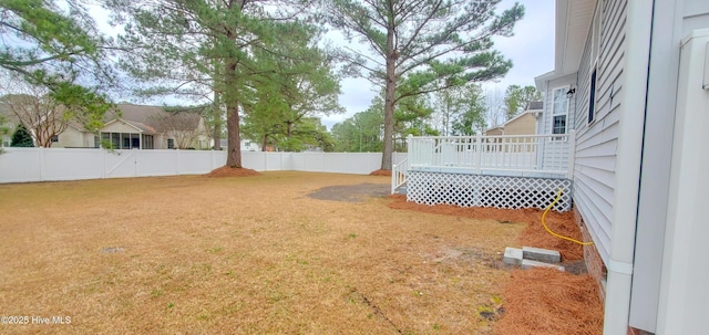 view of yard featuring a wooden deck