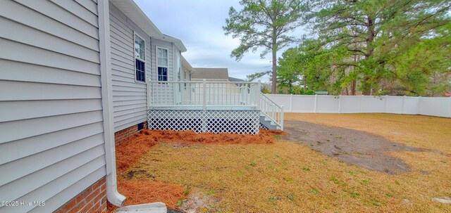 wooden deck with a yard