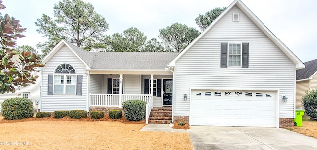 view of front of house featuring a garage and covered porch