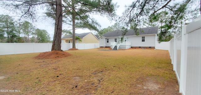 rear view of house featuring a lawn