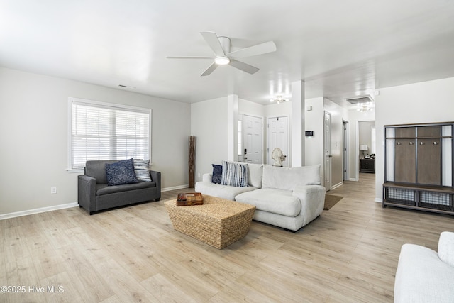 living room featuring ceiling fan and light wood-type flooring