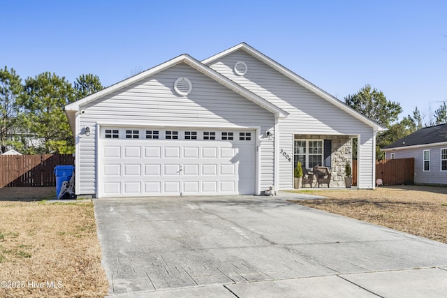 ranch-style house featuring a garage and a front yard