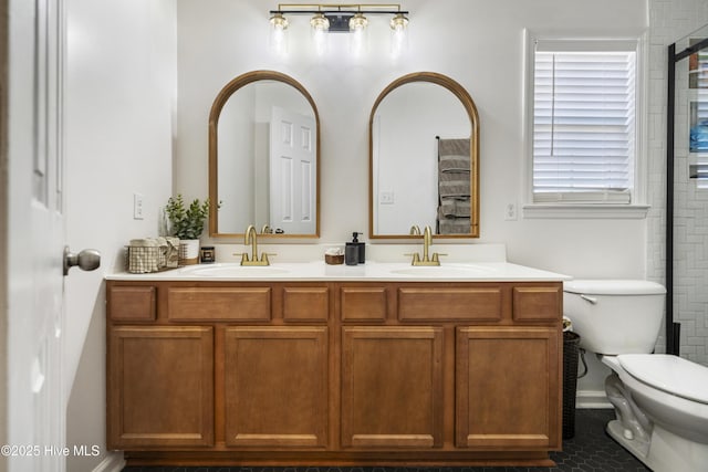 bathroom featuring vanity and toilet