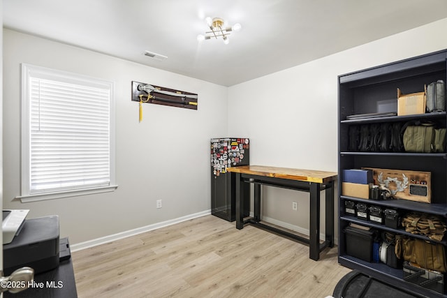 office with light hardwood / wood-style floors