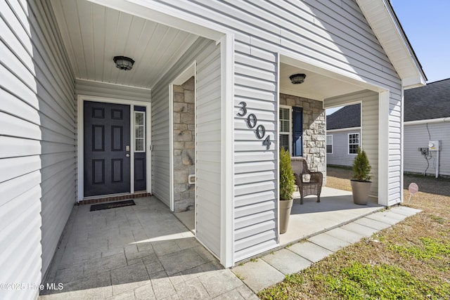 property entrance featuring covered porch