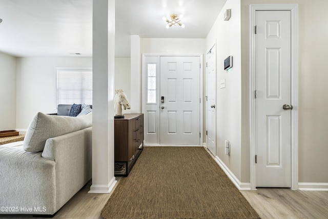 foyer entrance with hardwood / wood-style floors