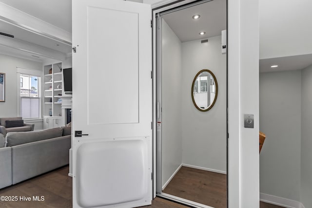 interior space featuring recessed lighting, wood finished floors, and baseboards