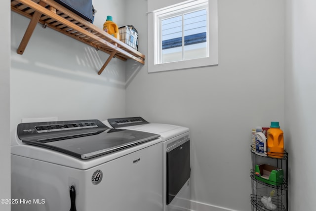 clothes washing area with laundry area and washer and dryer