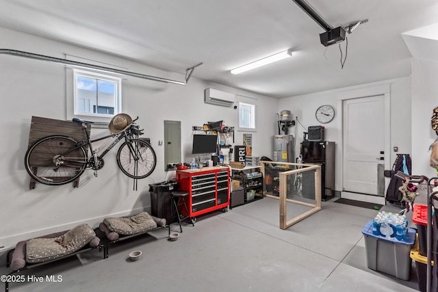 garage featuring an AC wall unit, a workshop area, a garage door opener, and electric water heater