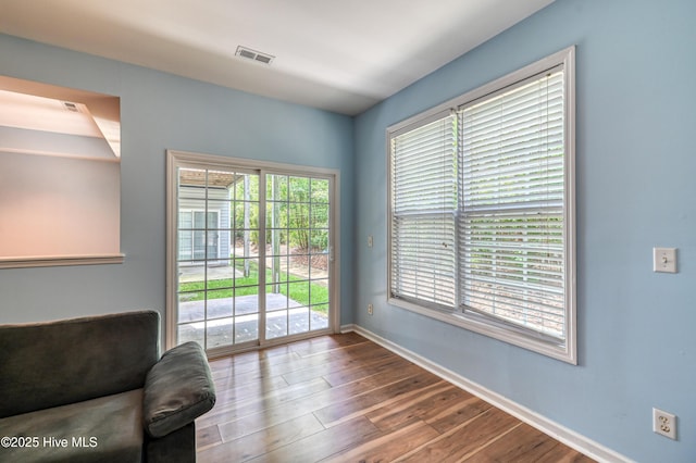 unfurnished room with hardwood / wood-style flooring