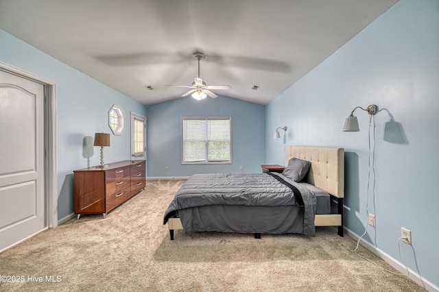 carpeted bedroom featuring vaulted ceiling and ceiling fan