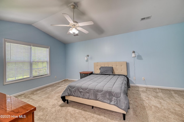 carpeted bedroom featuring vaulted ceiling and ceiling fan