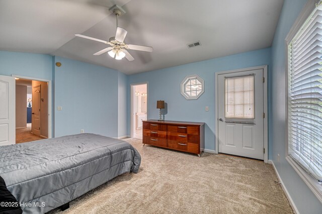 bedroom featuring ceiling fan, lofted ceiling, and light carpet