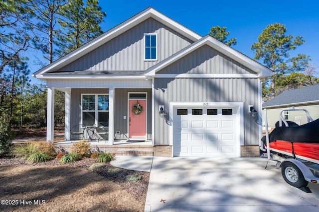 view of front facade featuring a garage and covered porch