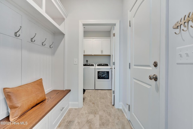 mudroom with washer and clothes dryer