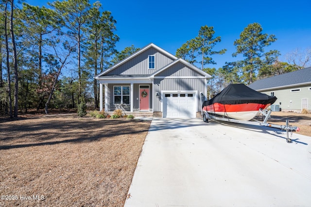 view of front of property featuring a garage and covered porch