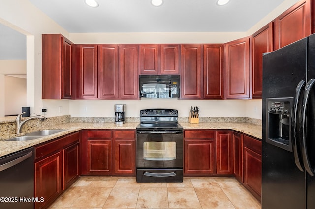 kitchen with light tile patterned floors, light stone countertops, sink, and black appliances