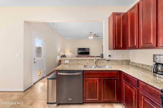 kitchen featuring light stone countertops, sink, stainless steel dishwasher, and kitchen peninsula