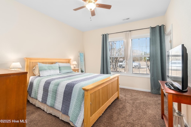 bedroom with ceiling fan and dark carpet