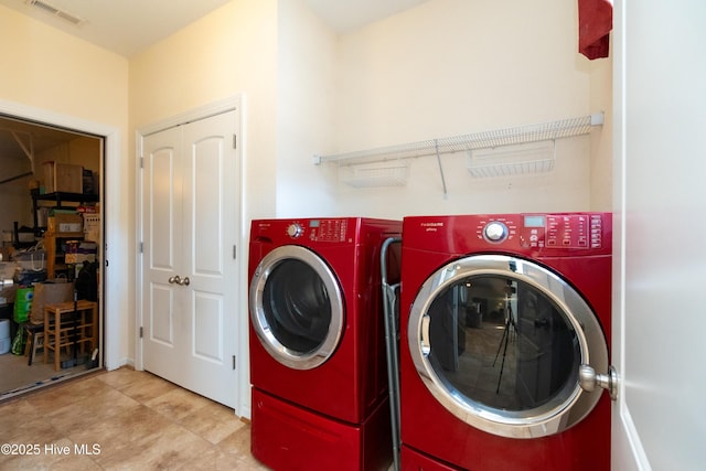 washroom with independent washer and dryer