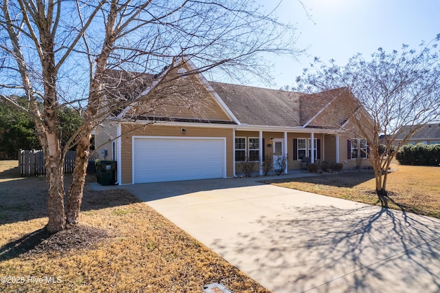 ranch-style house with a garage, a front yard, and covered porch