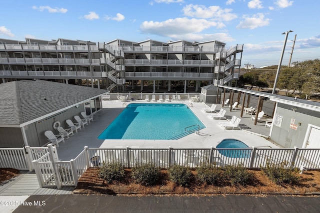 view of swimming pool with a patio