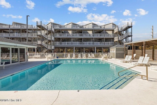 view of swimming pool featuring a patio