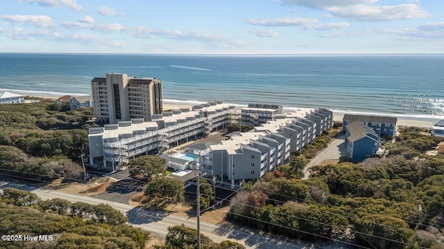 aerial view with a water view and a beach view