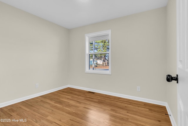 unfurnished room with light hardwood / wood-style floors