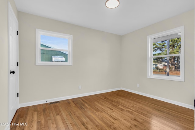 unfurnished room featuring wood-type flooring