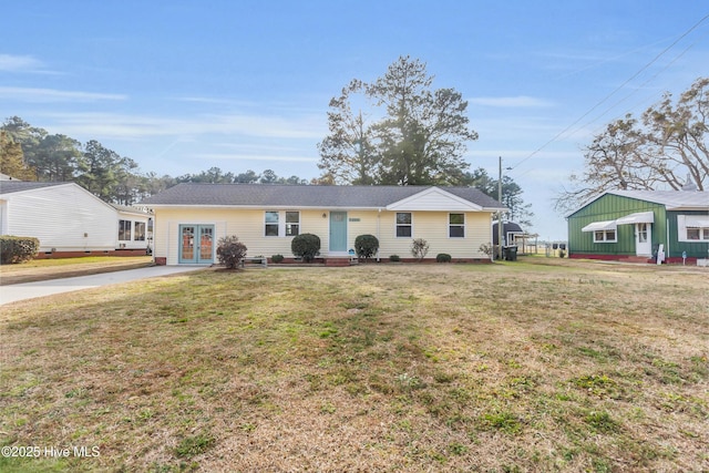 single story home with a front yard and french doors