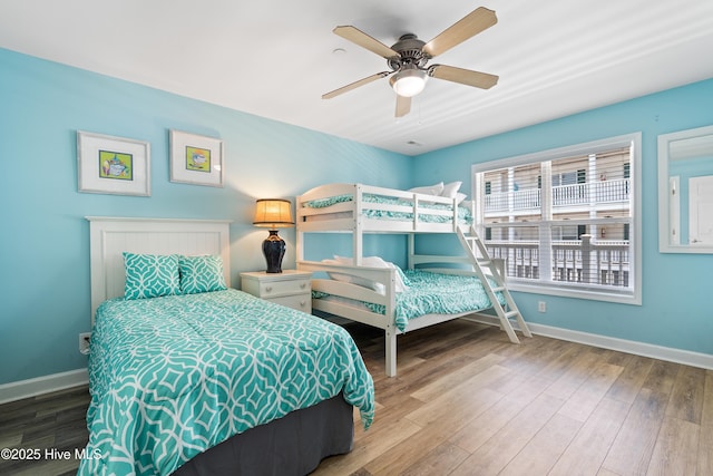 bedroom with ceiling fan and wood-type flooring