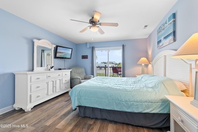 bedroom with dark wood-type flooring, ceiling fan, and access to outside