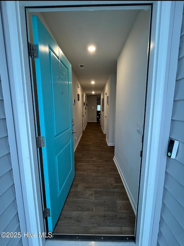 corridor with dark wood-type flooring