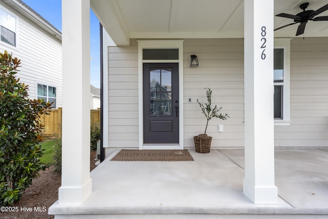 doorway to property featuring ceiling fan