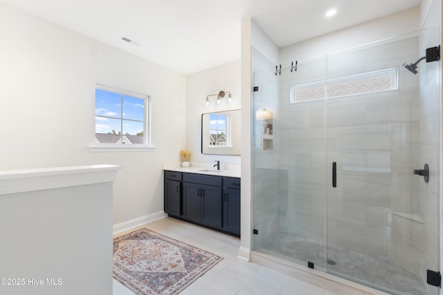 bathroom featuring vanity and walk in shower